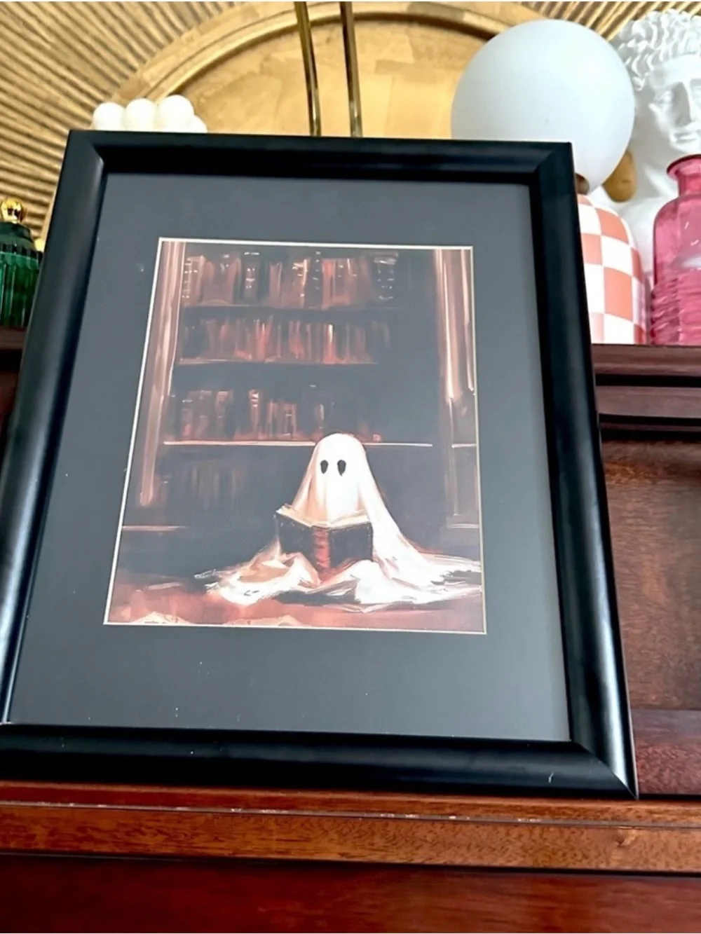 Cute Spooky Ghost Reading a Book in a Library Canvas Print Black Framed Wall Art